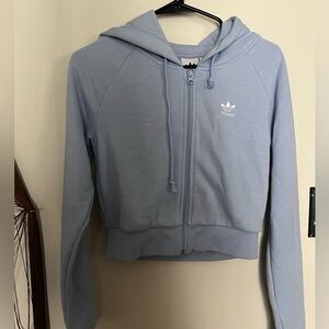 Light purple, cropped zip up jacket.